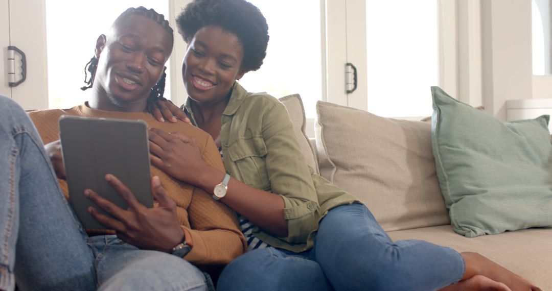 Cozy Couple Relaxing at Home Sharing Digital Experience
