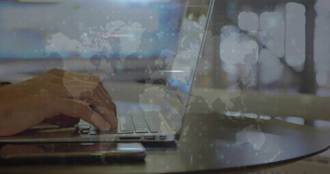 Hands Typing on Laptop with Global Network Overlay