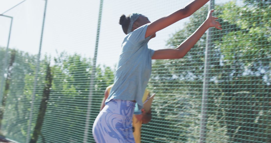 Young Woman Playing Tennis Outdoors Reaching for Shot - Free Images, Stock Photos and Pictures on Pikwizard.com