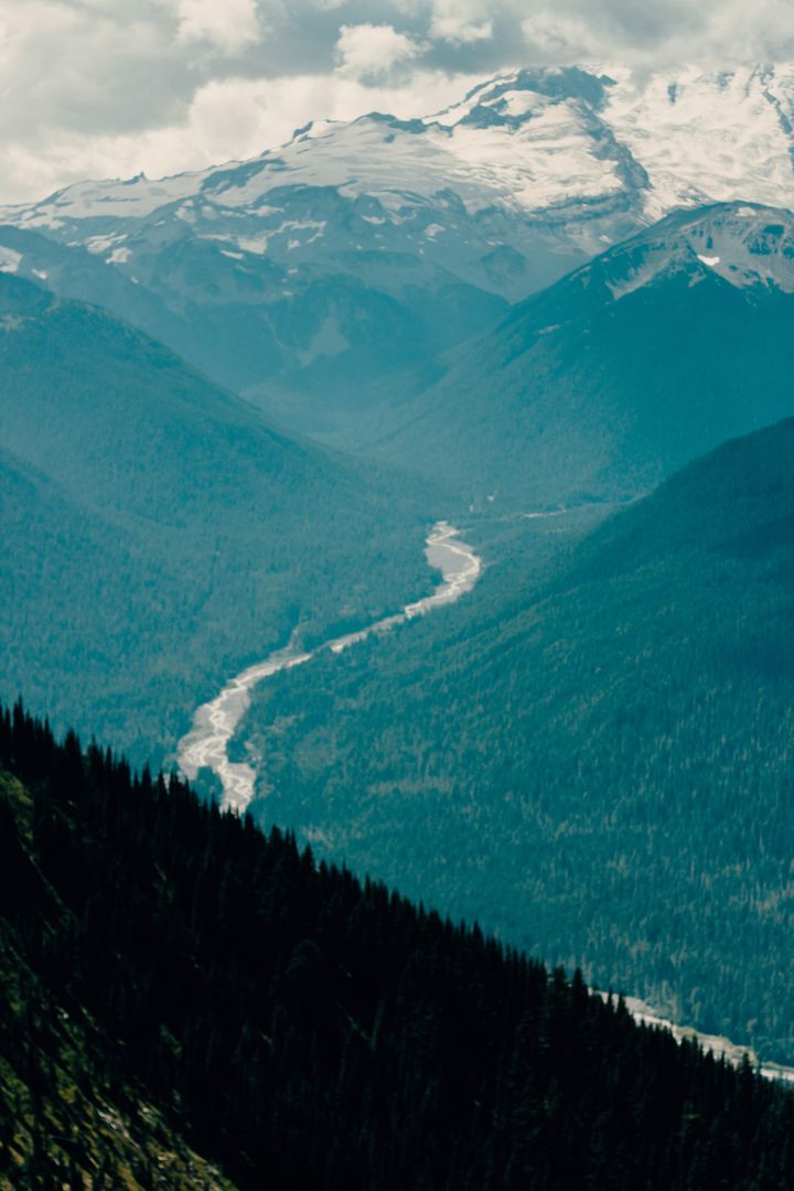 Majestic Mountain Range with Flowing River - Free Images, Stock Photos and Pictures on Pikwizard.com