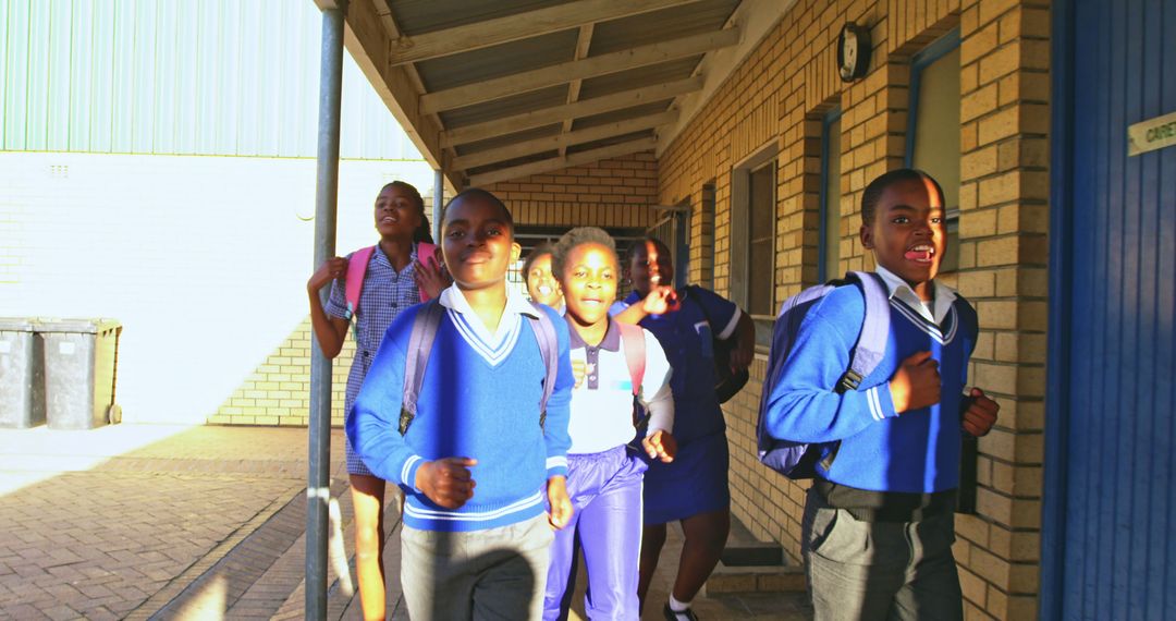 Happy Schoolchildren Exiting Classroom Wearing Backpacks