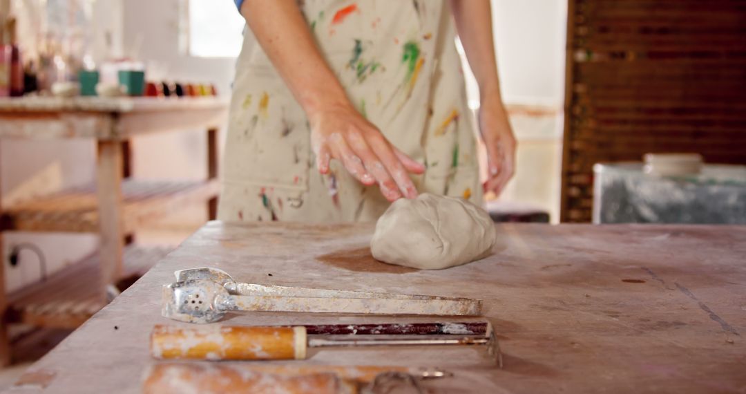 Artist Preparing Clay for Sculpting in Studio - Free Images, Stock Photos and Pictures on Pikwizard.com