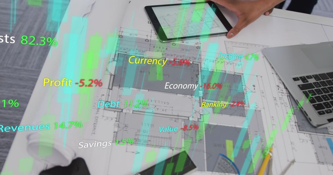 Hands Touching Interactive Financial Data and Architectural Plans on Desk