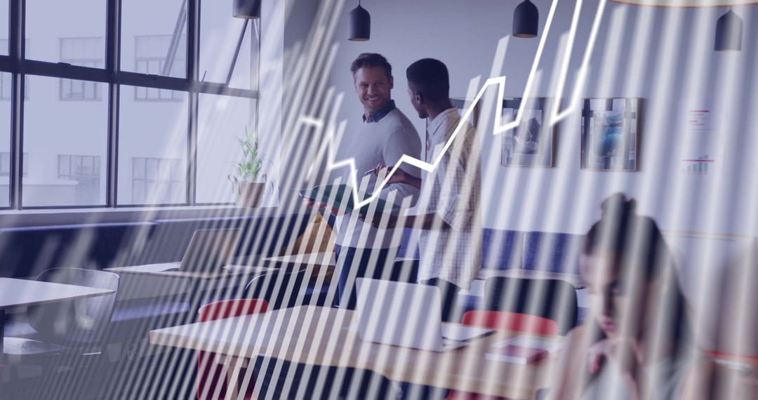 Two Professionals Analyzing Digital Chart in Modern Office