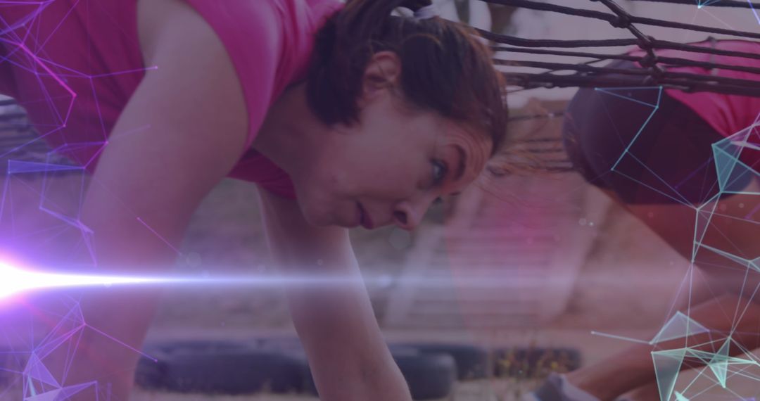 Diverse Women Crawling on Obstacle Course with Digital Overlay