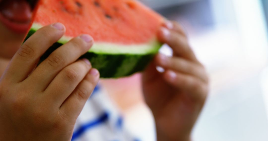 Close-Up of Child Eating Juicy Watermelon Slice on Summer Day - Free Images, Stock Photos and Pictures on Pikwizard.com