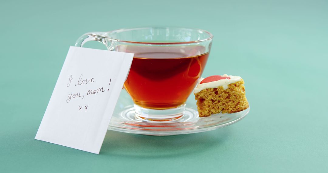 Tea with Cupcake and Mother's Day Card on Light Green Background - Free Images, Stock Photos and Pictures on Pikwizard.com