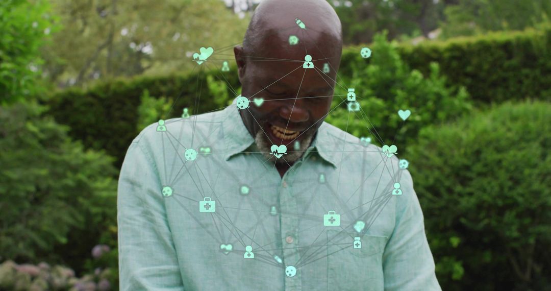 Senior Man Engaging with Virtual Health Interface in Garden