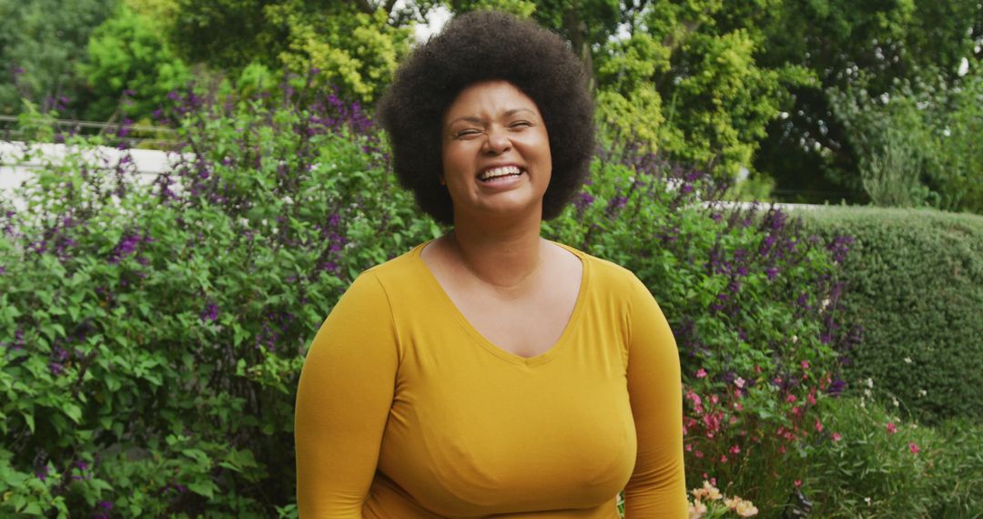 Image of happy plus size african american woman standing in garden - Free Images, Stock Photos and Pictures on Pikwizard.com