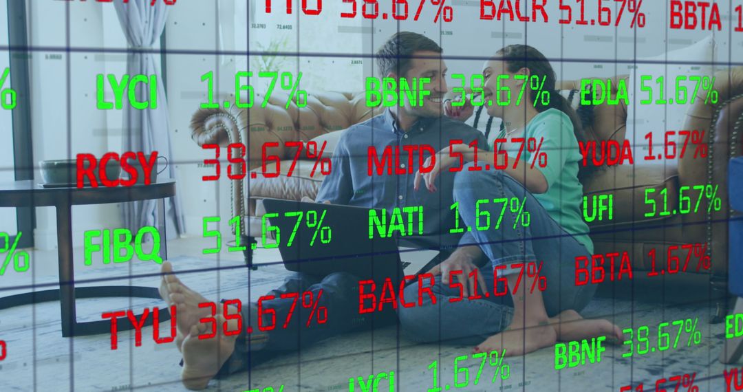 Couple Using Laptop with Stock Market Data Overlay