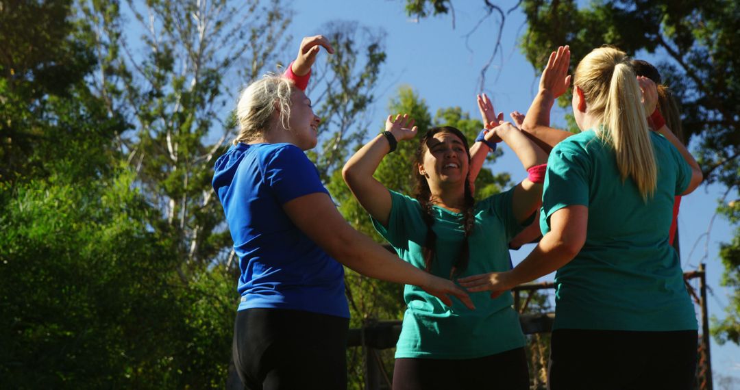 Group of Energetic Women Cheering Together Outdoors on Sunny Day - Free Images, Stock Photos and Pictures on Pikwizard.com