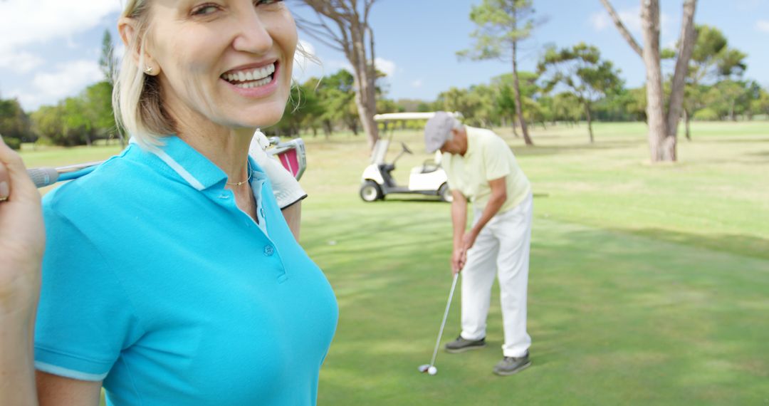 Happy Female Golfer Enjoying Game on Course