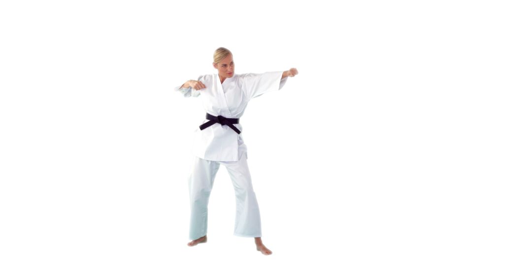 Woman Practicing Karate in White Gi and Black Belt on White Background - Free Images, Stock Photos and Pictures on Pikwizard.com