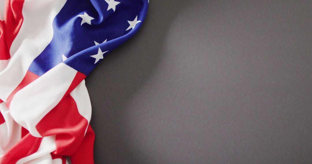 Close-Up of American Flag Draped Over Dark Surface - Free Images, Stock Photos and Pictures on Pikwizard.com