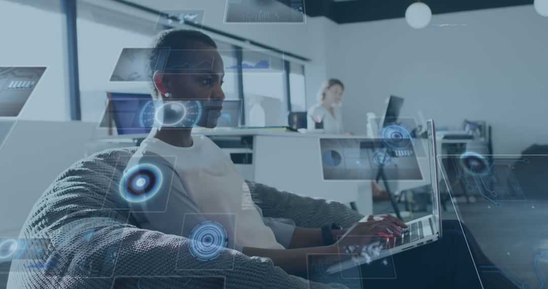 Tech-Savvy Professional Using Laptop in Modern Office