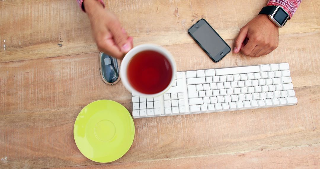 Close Call with Tea Spill on Office Desk Near Keyboard