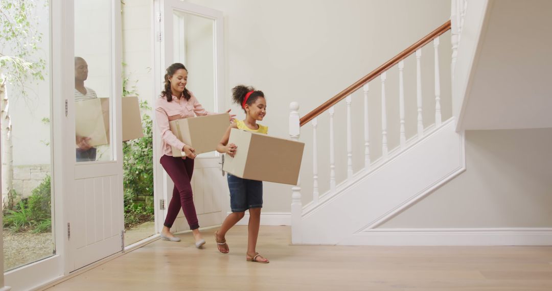 Excited Family Moving Into New Home Carrying Boxes - Free Images, Stock Photos and Pictures on Pikwizard.com