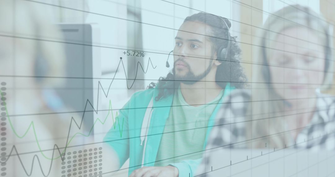 Focused Call Center Agents Analyzing Data in Modern Office