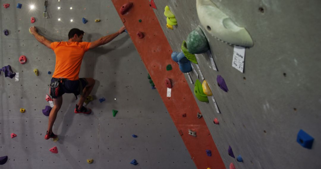 Man Climbing Indoor Bouldering Wall in Gym - Free Images, Stock Photos and Pictures on Pikwizard.com