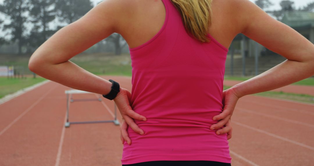 Female Athlete Preparing for Hurdle Training on Track - Free Images, Stock Photos and Pictures on Pikwizard.com