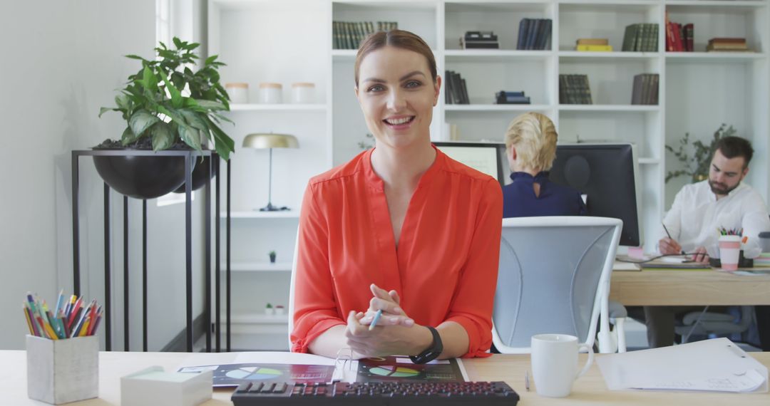 Smiling caucasian woman working in modern office environment