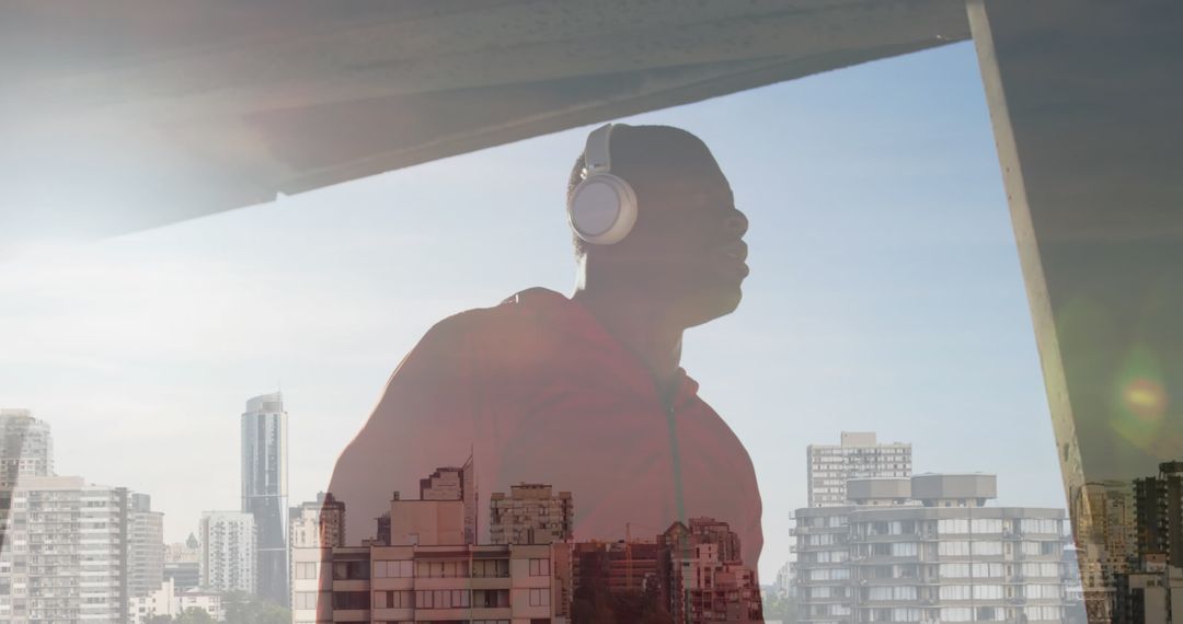 Man Enjoying Music with Urban Panorama in Background