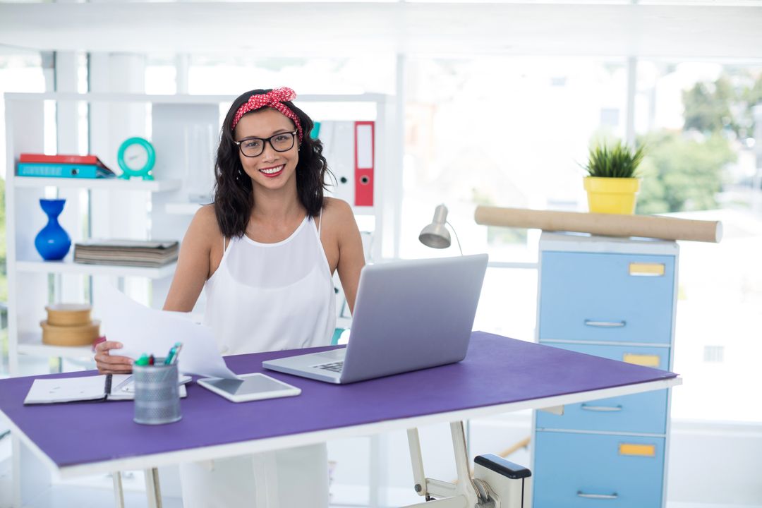 Smiling Executive Woman Working at Modern Office Desk
