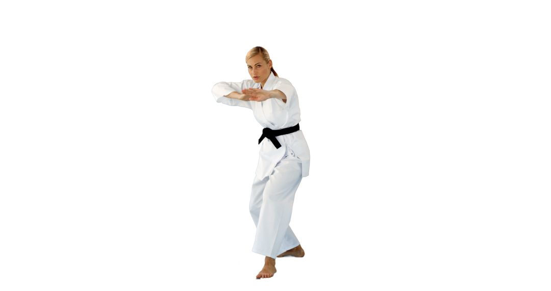 Female Master Demonstrating Karate Stance In Traditional Gi - Free Images, Stock Photos and Pictures on Pikwizard.com