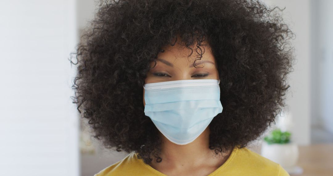 Young Woman Wearing Protective Face Mask Indoors - Free Images, Stock Photos and Pictures on Pikwizard.com