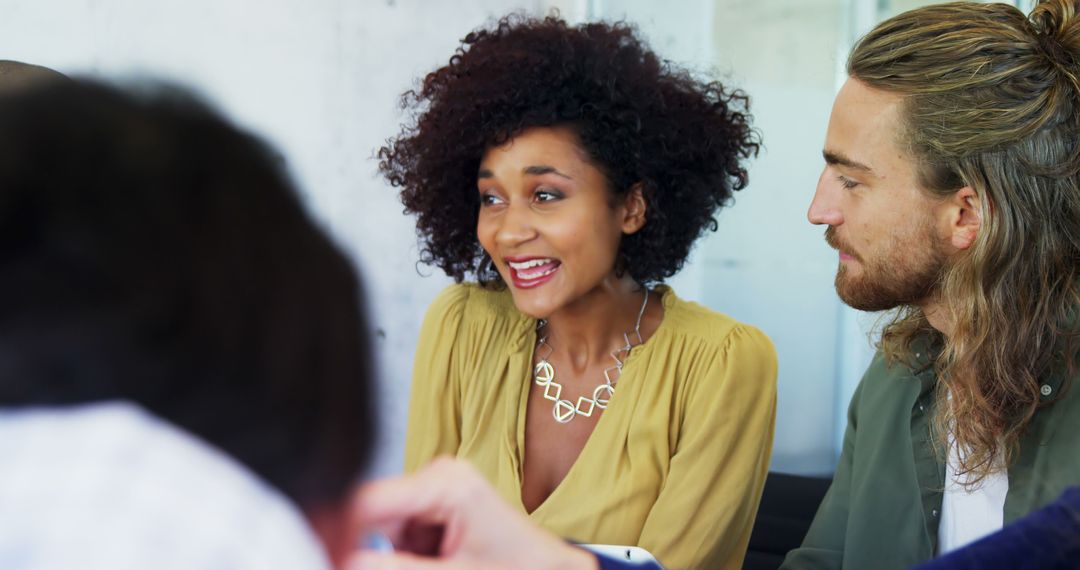 Diverse Team in Engaging Conversation with Positive Atmosphere