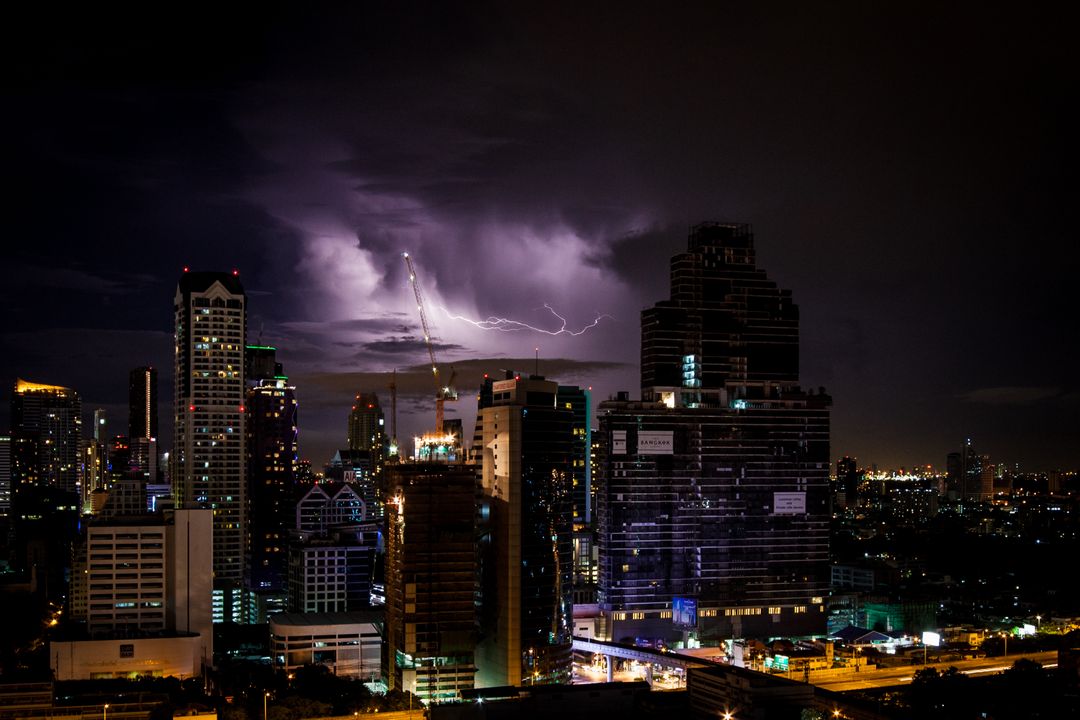 Lightning Storm over City Skyline at Night - Free Images, Stock Photos and Pictures on Pikwizard.com