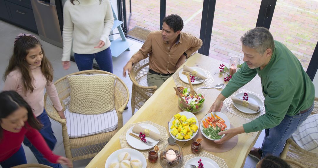 Multigenerational Family Gathering Preparing Festive Meal Around Rustic Wooden Dining Table