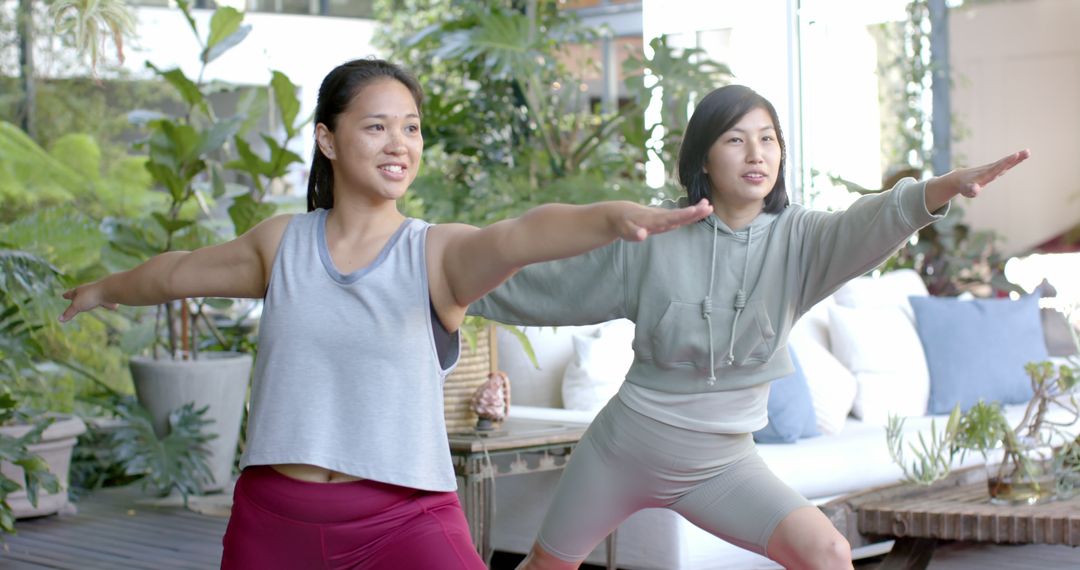 Two Women Practicing Yoga in Modern Garden - Free Images, Stock Photos and Pictures on Pikwizard.com