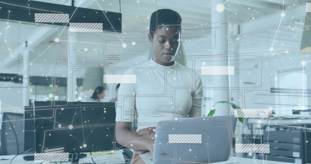 IT Professional Engaging with Technology in Open Office Setting