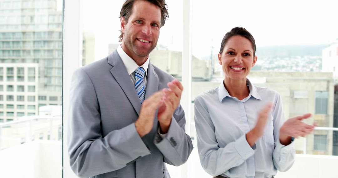 Business Professionals Smiling and Clapping in Modern Office - Free Images, Stock Photos and Pictures on Pikwizard.com