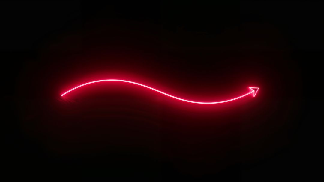 Glowing Red Neon Curved Arrow on Dark Background