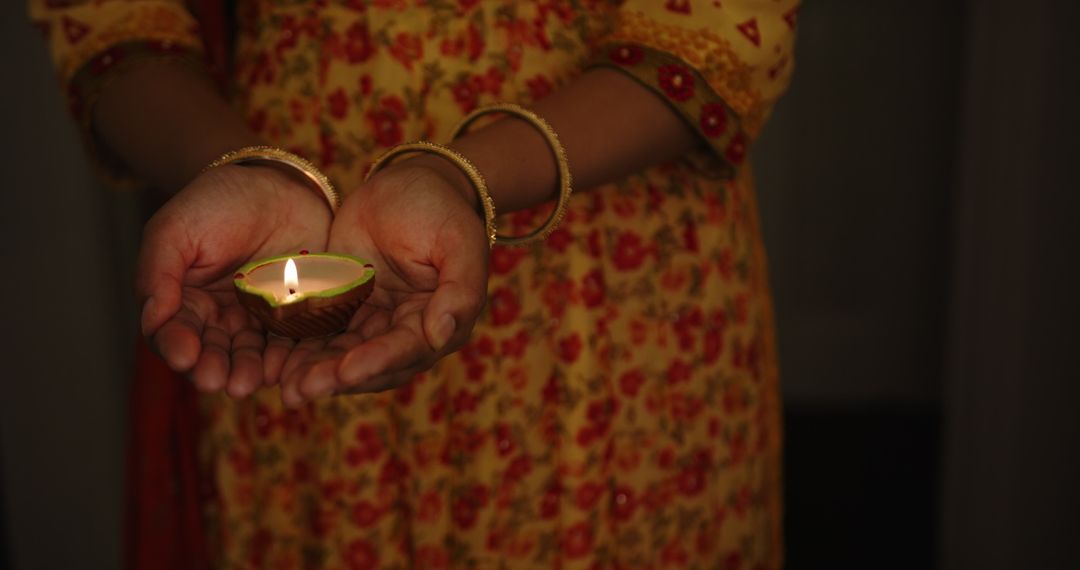 Indian Woman Celebrating Diwali with Traditional Lit Diya