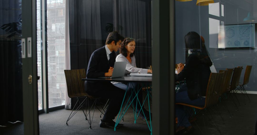 Diverse Business Team Collaborating in Conference Room Discussion