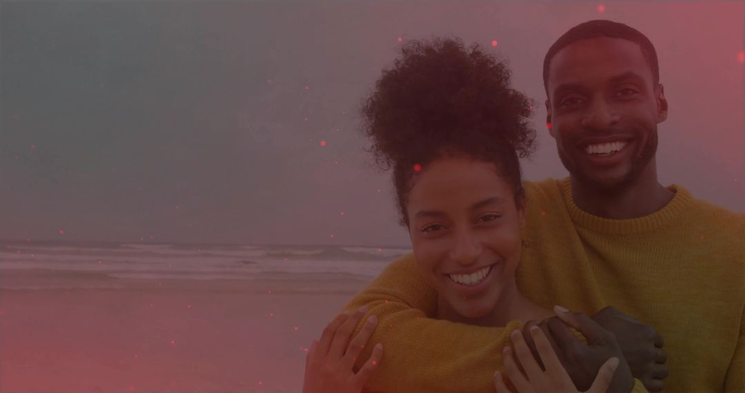 Affectionate Couple Embracing at Beachfront Under Cloudy Sky
