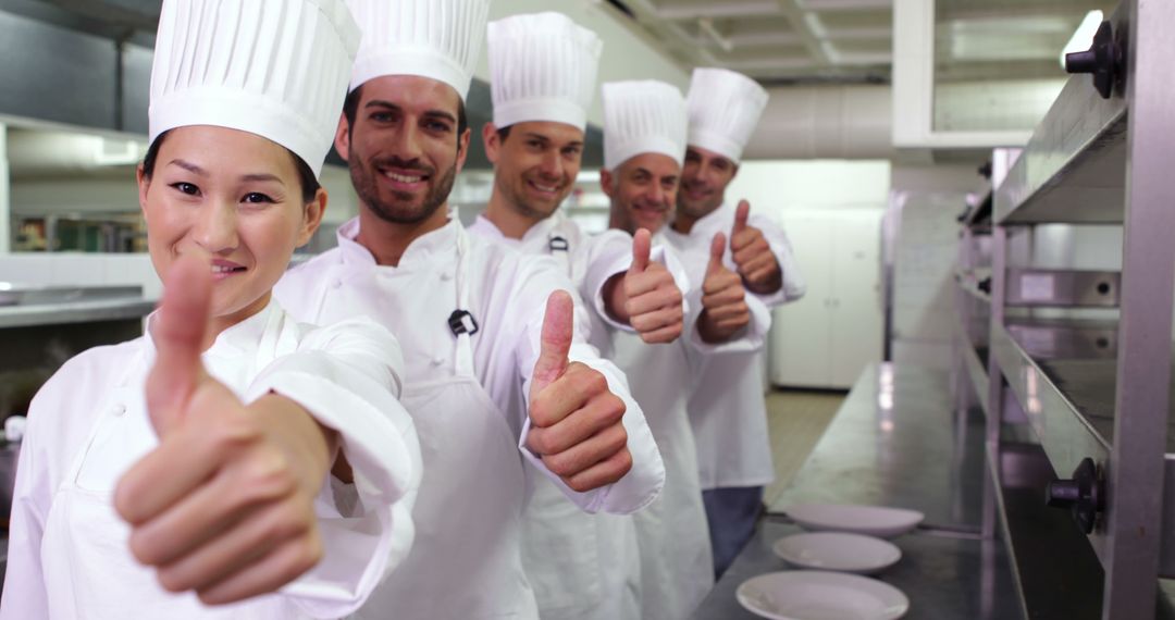 Chefs in Uniforms Giving Thumbs Up in Professional Kitchen - Free Images, Stock Photos and Pictures on Pikwizard.com