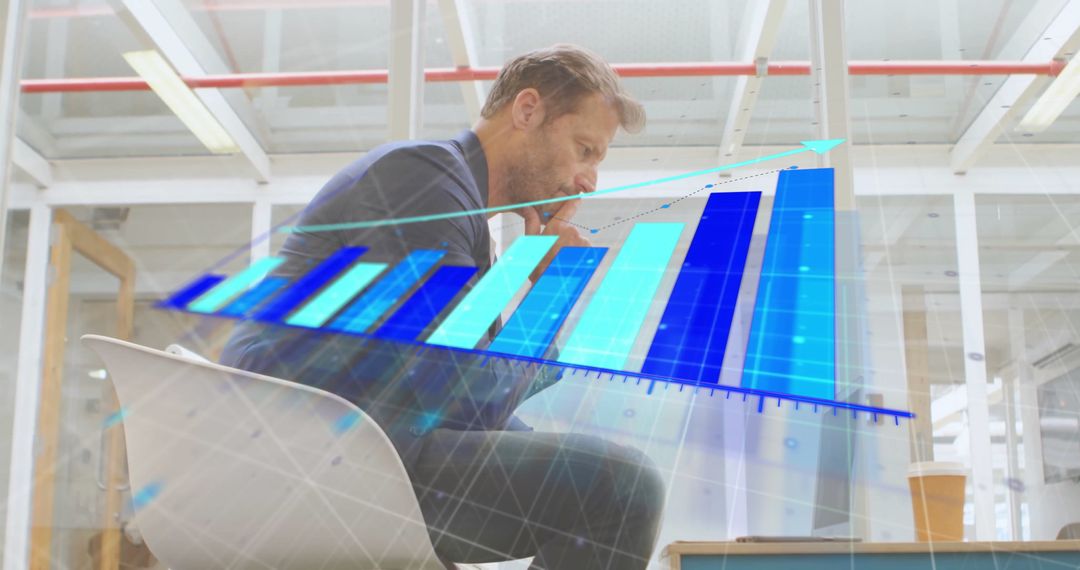 Businessman Analyzing Financial Growth with Digital Graph Interface