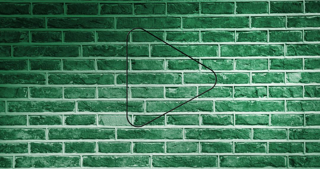 Neon Arrow Symbol Illuminating Green Brick Wall Background - Free Images, Stock Photos and Pictures on Pikwizard.com