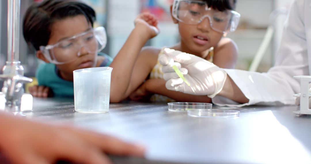 Children Observing Science Experiment in School Laboratory