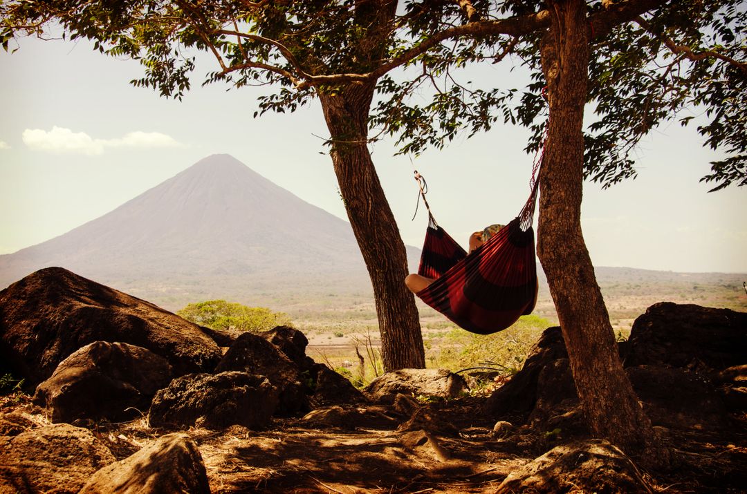 Relaxing in Hammock with Stunning Mountain View in Background - Free Images, Stock Photos and Pictures on Pikwizard.com