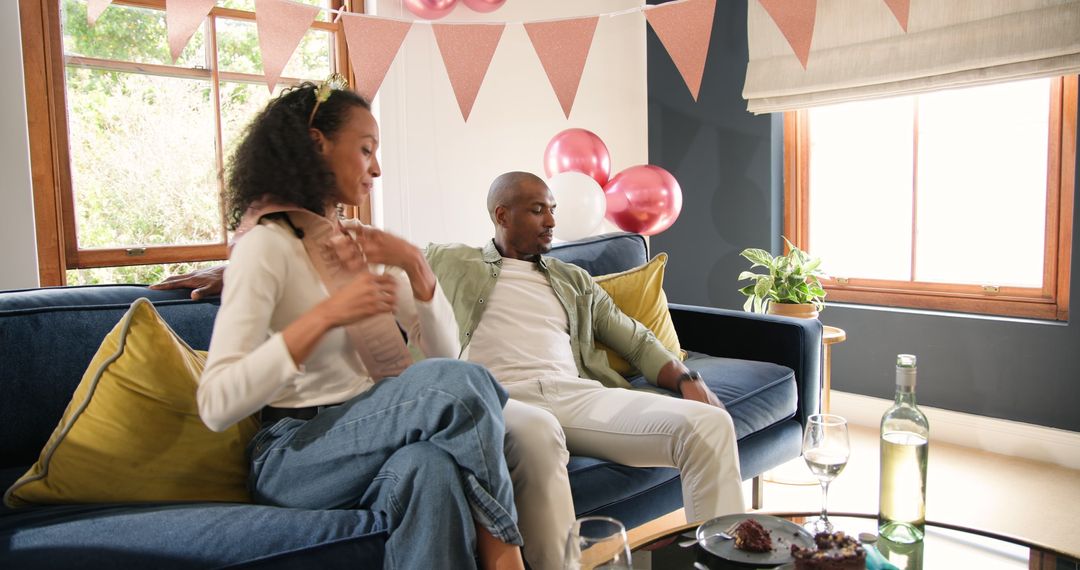 Couple Celebrating Relaxing with Wine and Cake at Home