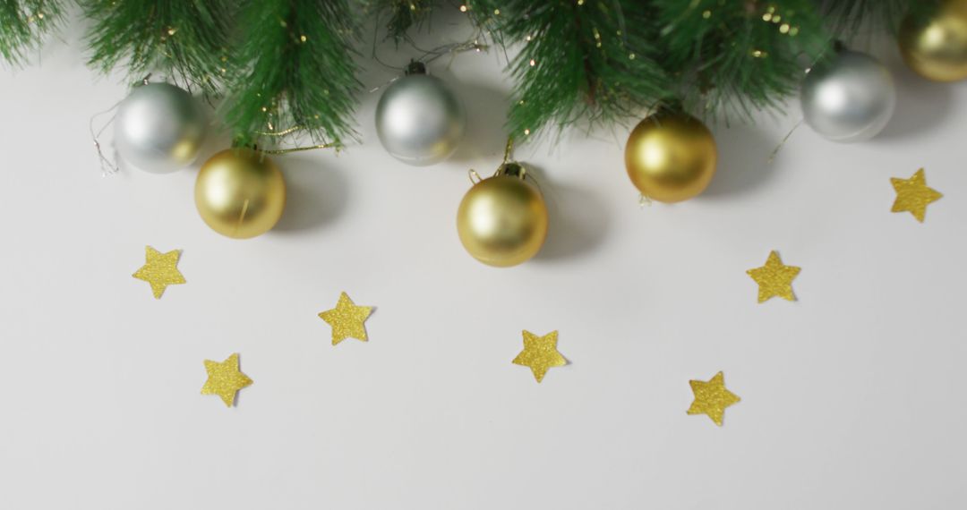 Image of christmas decorations with gold baubles and stars with copy space on white background - Free Images, Stock Photos and Pictures on Pikwizard.com