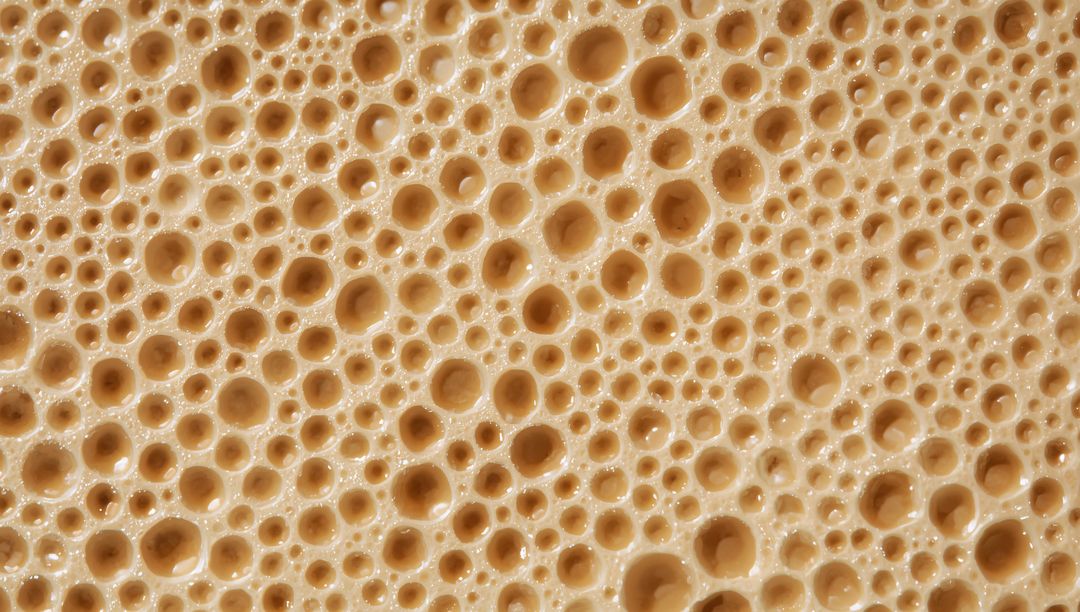 Macro Foam Bubble Texture Warm Beige Glossy Honeycomb Pattern for Backgrounds and Design