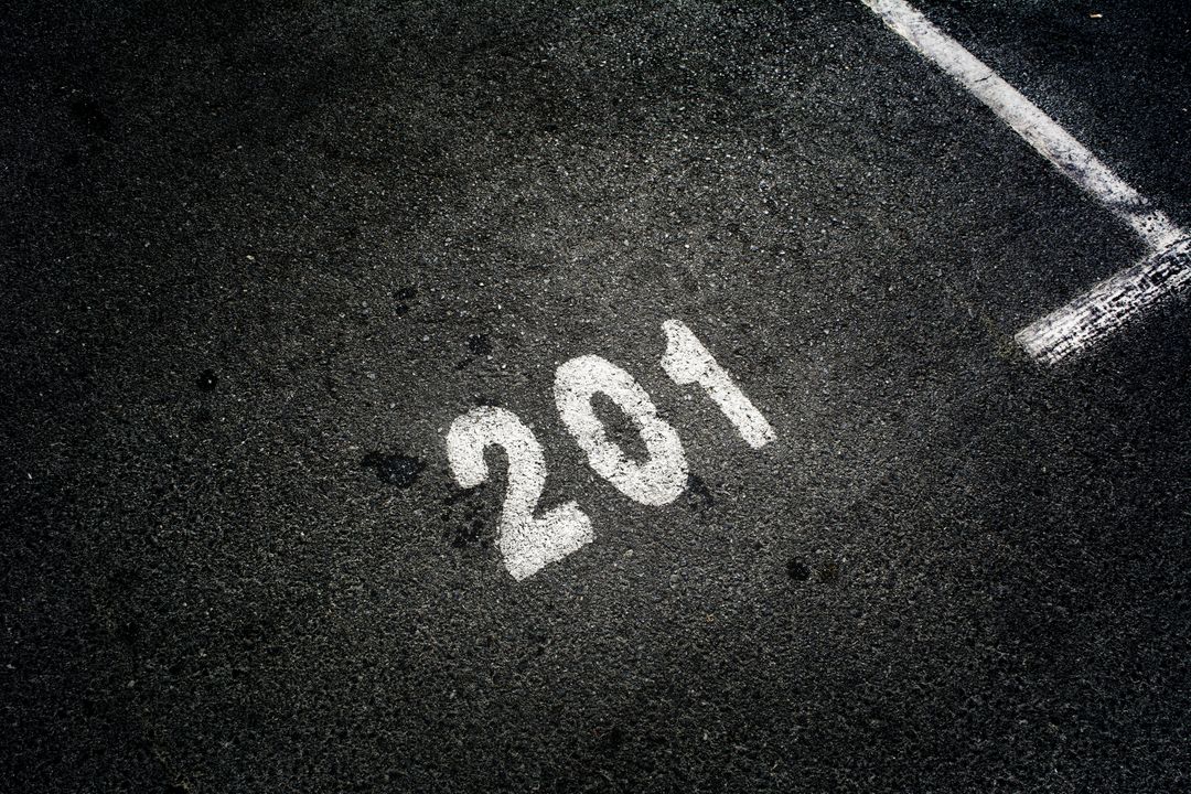Parking Spot Number 201 Marked on Asphalt Surface - Free Images, Stock Photos and Pictures on Pikwizard.com