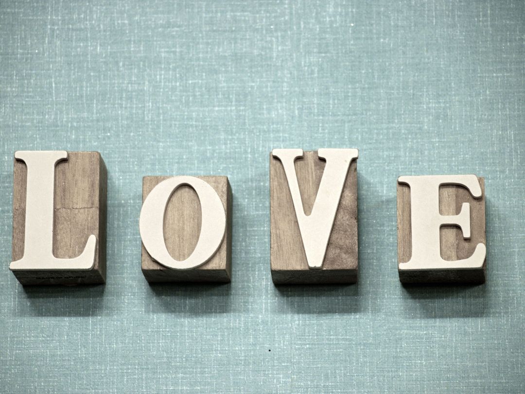 Wooden Love Letters on Blue Linen Background