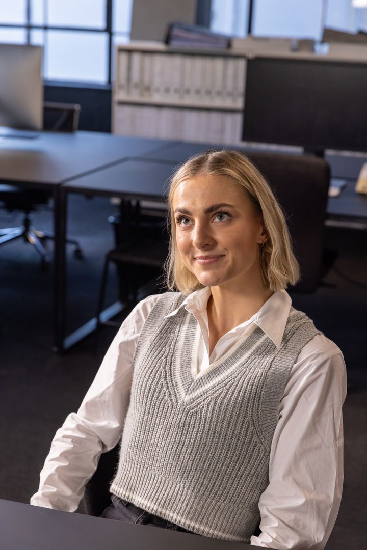 Professional Woman Working in Open-Plan Office Environment